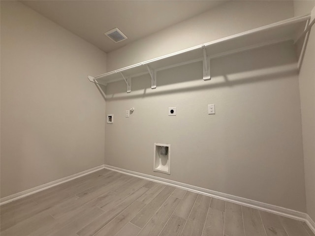 8116 Tourmaline Way, Texas City, TX 77591 - washroom with hookup for an electric dryer, hookup for a gas dryer, light wood finished floors, and hookup for a washing machine