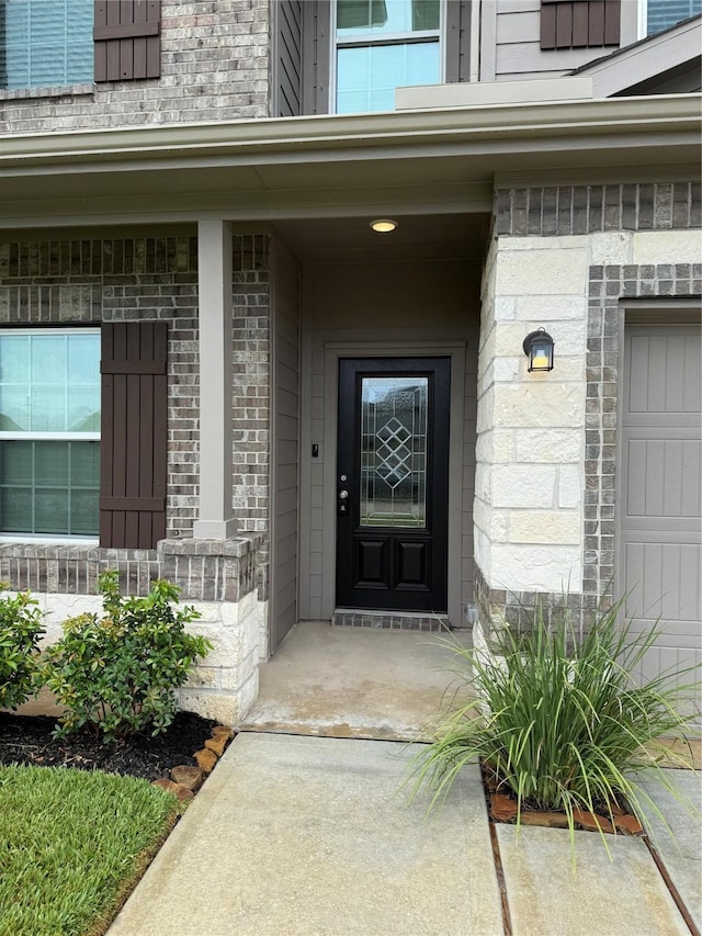 8116 Tourmaline Way, Texas City, TX 77591 - view of exterior entry with brick siding and a porch
