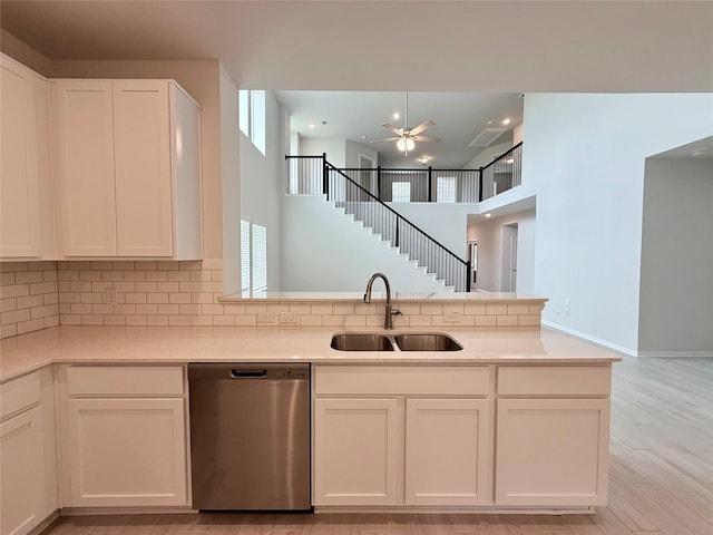 8116 Tourmaline Way, Texas City, TX 77591 - kitchen featuring stainless steel dishwasher, ceiling fan, white cabinets, and a towering ceiling