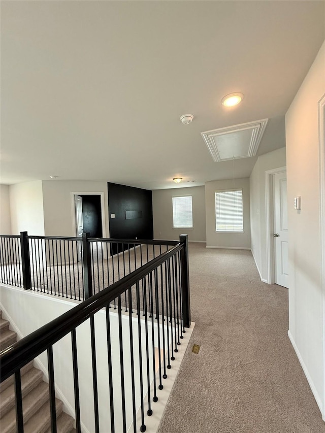 8116 Tourmaline Way, Texas City, TX 77591 - hallway featuring attic access, light colored carpet, and an upstairs landing