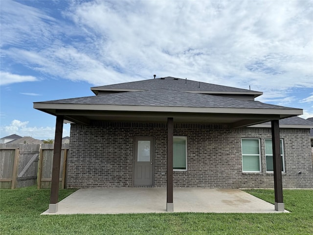 8116 Tourmaline Way, Texas City, TX 77591 - back of property with brick siding, a patio area, and a shingled roof