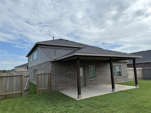 8116 Tourmaline Way, Texas City, TX 77591 - rear view of house featuring brick siding, a patio area, and roof with shingles