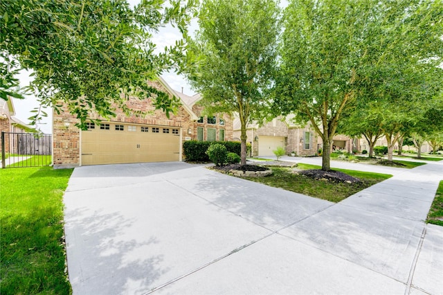4927 Caponi Falls Ln, Katy, TX 77494 - view of property hidden behind natural elements featuring driveway, an attached garage, and brick siding