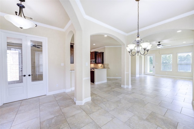 4927 Caponi Falls Ln, Katy, TX 77494 - foyer with a ceiling fan, arched walkways, ornamental molding, a chandelier, and recessed lighting
