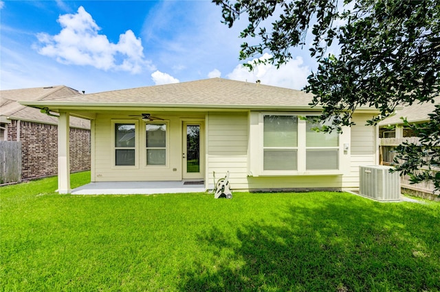 4927 Caponi Falls Ln, Katy, TX 77494 - rear view of house featuring a ceiling fan, a patio, and roof with shingles