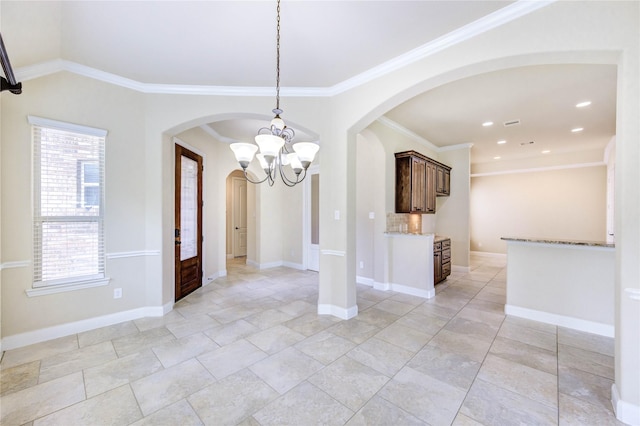 4927 Caponi Falls Ln, Katy, TX 77494 - unfurnished dining area with a chandelier, arched walkways, crown molding, and recessed lighting