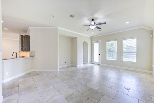 4927 Caponi Falls Ln, Katy, TX 77494 - unfurnished living room featuring arched walkways, a ceiling fan, crown molding, recessed lighting, and light tile patterned flooring