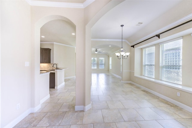 4927 Caponi Falls Ln, Katy, TX 77494 - spare room with arched walkways, crown molding, a chandelier, ceiling fan, and recessed lighting
