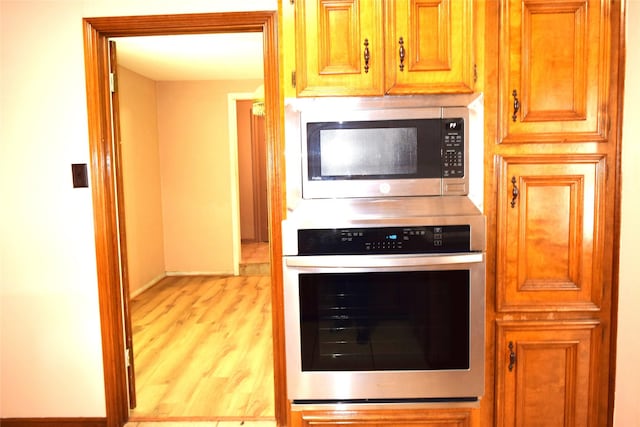 7331 Rancho Mission Dr, Houston, TX 77083 - kitchen featuring stainless steel appliances and light wood finished floors