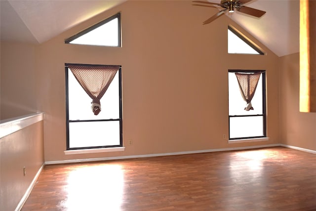 7331 Rancho Mission Dr, Houston, TX 77083 - unfurnished room with plenty of natural light, wood finished floors, a ceiling fan, and high vaulted ceiling