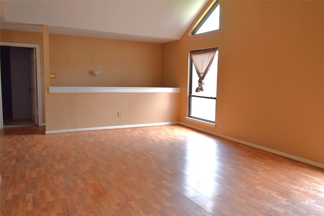 7331 Rancho Mission Dr, Houston, TX 77083 - empty room featuring vaulted ceiling and wood finished floors