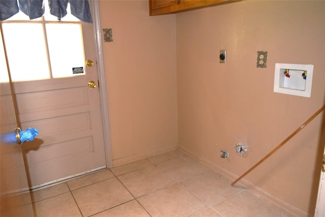 7331 Rancho Mission Dr, Houston, TX 77083 - laundry area featuring hookup for a washing machine, gas dryer hookup, electric dryer hookup, and light tile patterned floors