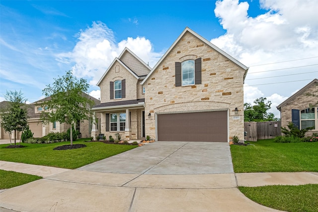 21031 Secretariat Meadow Ln, Tomball, TX 77377 - view of front of property with stone siding, a garage, and concrete driveway