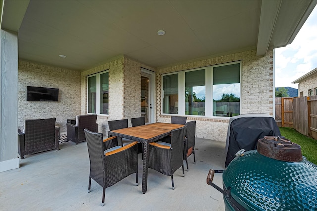 21031 Secretariat Meadow Ln, Tomball, TX 77377 - fenced backyard with outdoor dining area, a patio, and area for grilling