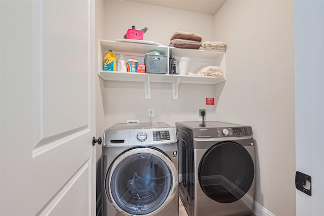21031 Secretariat Meadow Ln, Tomball, TX 77377 - laundry room featuring washer and clothes dryer