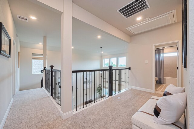 21031 Secretariat Meadow Ln, Tomball, TX 77377 - hall featuring attic access, carpet floors, and recessed lighting