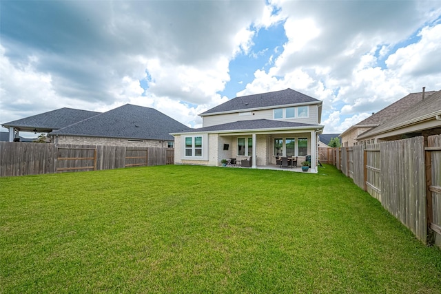 21031 Secretariat Meadow Ln, Tomball, TX 77377 - rear view of property featuring a patio area, a fenced backyard, and brick siding