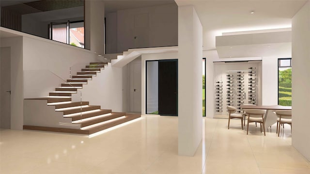 827 Bunker Hill Rd, Houston, TX 77024 - stairs featuring healthy amount of natural light and tile patterned flooring