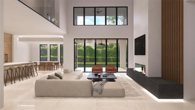 827 Bunker Hill Rd, Houston, TX 77024 - living area with a high ceiling, tile patterned floors, and a glass covered fireplace