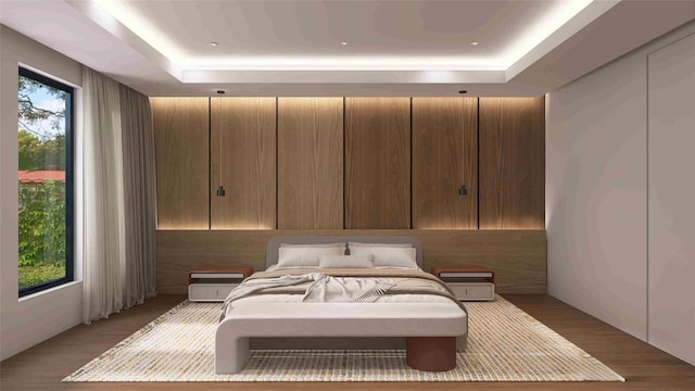 827 Bunker Hill Rd, Houston, TX 77024 - bedroom with a raised ceiling and wood finished floors