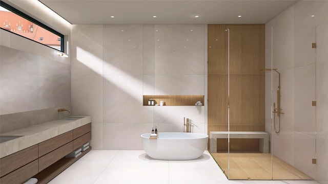 827 Bunker Hill Rd, Houston, TX 77024 - full bathroom with tile walls, a soaking tub, vanity, and a walk in shower