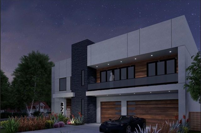 827 Bunker Hill Rd, Houston, TX 77024 - modern home with stone siding, a balcony, and an attached garage