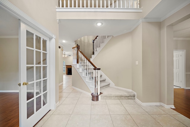5411 Davids Bend Dr, Sugar Land, TX 77479 - tiled foyer featuring crown molding, a fireplace, stairs, french doors, and recessed lighting