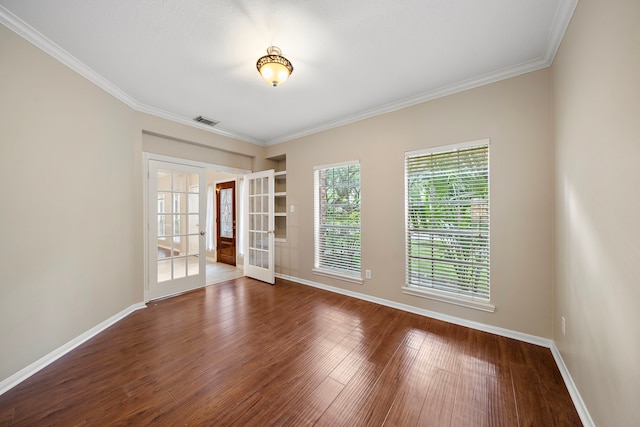 5411 Davids Bend Dr, Sugar Land, TX 77479 - spare room featuring french doors, wood finished floors, and ornamental molding