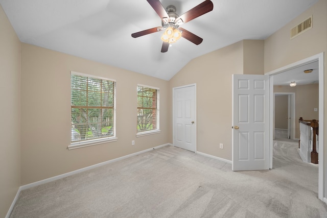 5411 Davids Bend Dr, Sugar Land, TX 77479 - unfurnished bedroom featuring lofted ceiling, light carpet, and a ceiling fan