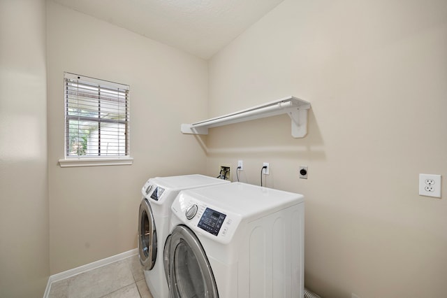 5411 Davids Bend Dr, Sugar Land, TX 77479 - washroom featuring washer and clothes dryer and light tile patterned flooring