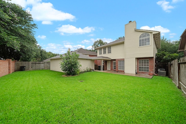 5411 Davids Bend Dr, Sugar Land, TX 77479 - rear view of property featuring brick siding, a patio area, a fenced backyard, and a chimney