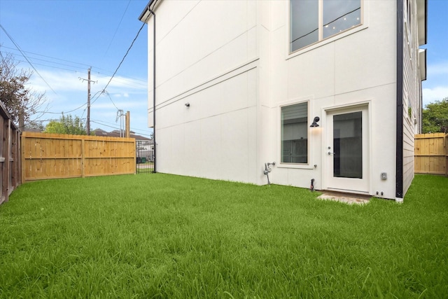 1609 Roy St, Houston, TX 77007 - back of house featuring a fenced backyard and stucco siding