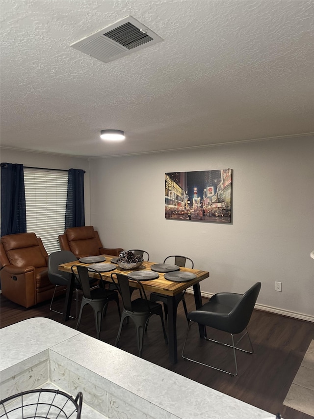 2379 Briarwest Blvd Unit 12, Houston, TX 77077 - dining room featuring wood finished floors and a textured ceiling