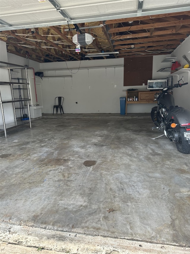 2379 Briarwest Blvd Unit 12, Houston, TX 77077 - garage featuring a garage door opener
