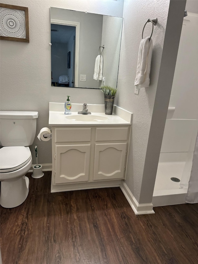 2379 Briarwest Blvd Unit 12, Houston, TX 77077 - bathroom featuring vanity, a shower stall, and wood finished floors