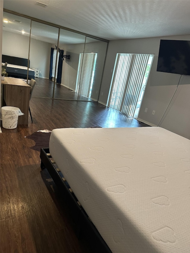 2379 Briarwest Blvd Unit 12, Houston, TX 77077 - bedroom featuring wood finished floors and baseboards
