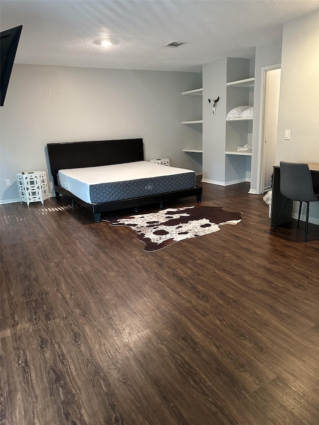 2379 Briarwest Blvd Unit 12, Houston, TX 77077 - bedroom with wood finished floors and a textured ceiling