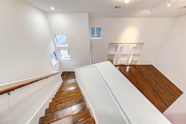 2902 Commerce St, Houston, TX 77003 - stairway with hardwood / wood-style floors, a skylight, and recessed lighting