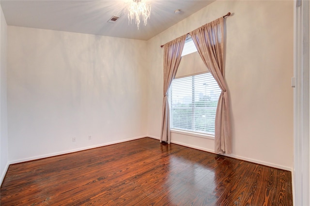 2902 Commerce St, Houston, TX 77003 - unfurnished room with a chandelier and wood finished floors