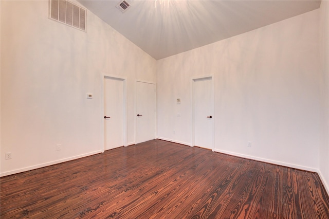 2902 Commerce St, Houston, TX 77003 - spare room featuring dark wood-type flooring and high vaulted ceiling