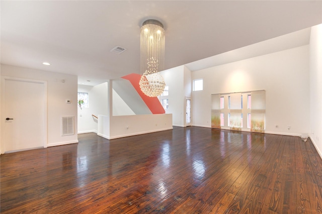 2902 Commerce St, Houston, TX 77003 - unfurnished living room featuring a chandelier, healthy amount of natural light, wood-type flooring, and recessed lighting