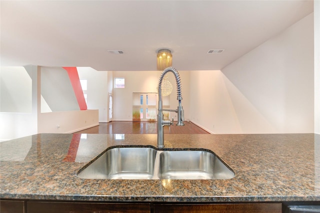 2902 Commerce St, Houston, TX 77003 - kitchen view of dark stone countertops and dark brown cabinets