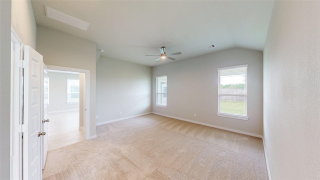 333 Spruce Oak Ln, Waller, TX 77484 - empty room featuring light colored carpet, vaulted ceiling, and ceiling fan