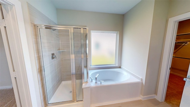 333 Spruce Oak Ln, Waller, TX 77484 - full bathroom with a shower stall, a walk in closet, and a bath