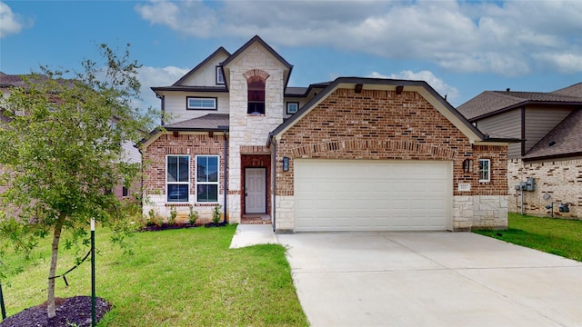 333 Spruce Oak Ln, Waller, TX 77484 - french country inspired facade featuring an attached garage, stone siding, a front yard, concrete driveway, and brick siding