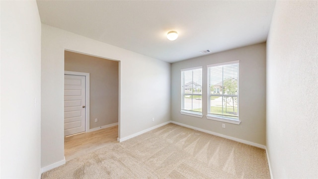 333 Spruce Oak Ln, Waller, TX 77484 - empty room featuring light colored carpet and baseboards