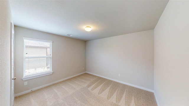 333 Spruce Oak Ln, Waller, TX 77484 - spare room featuring light colored carpet and baseboards