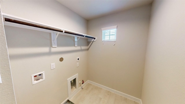333 Spruce Oak Ln, Waller, TX 77484 - laundry area with gas dryer hookup, hookup for an electric dryer, hookup for a washing machine, and light wood-style flooring