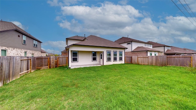 333 Spruce Oak Ln, Waller, TX 77484 - rear view of house featuring a fenced backyard, a patio area, and a shingled roof