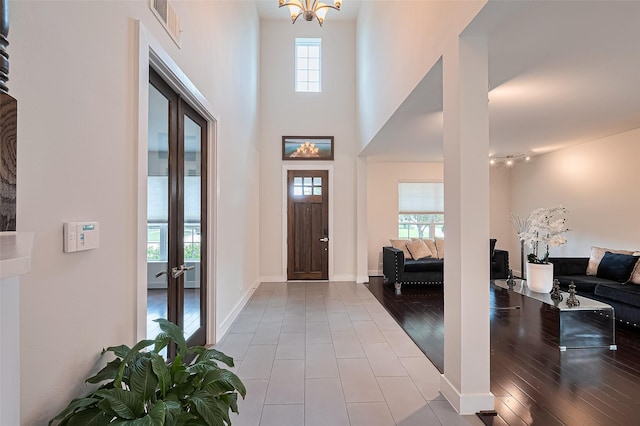 18806 Dove Creek Springs Trl, Cypress, TX 77433 - entryway with a chandelier, french doors, and wood finished floors
